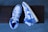 A pair of stylish low-top shoes displayed on a wooden surface.
