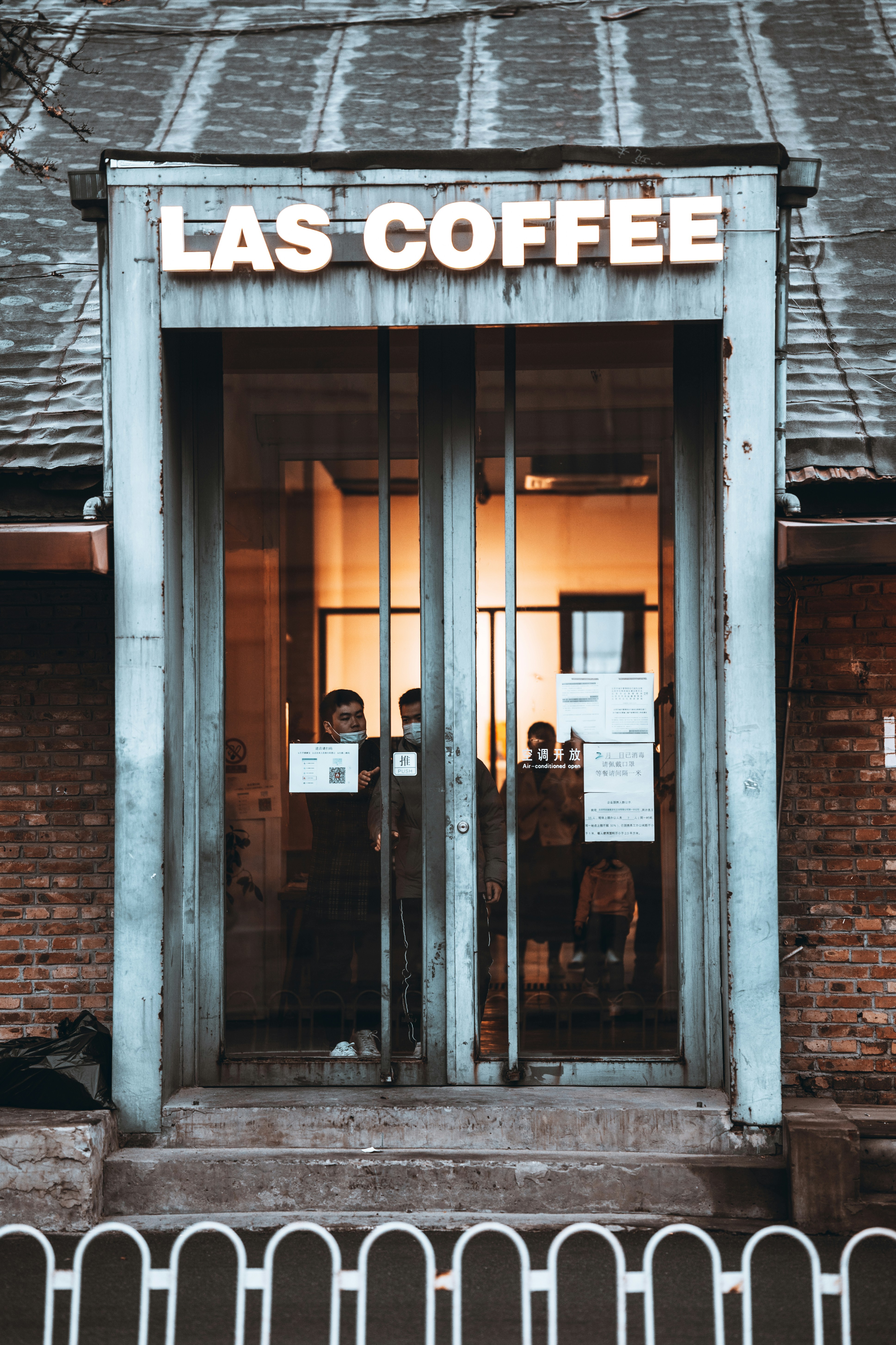 Brown brick building with glass window photo – Free Door Image on Unsplash