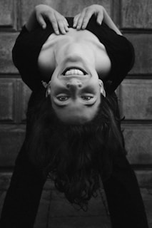 Visual of a dizzy person holding onto a wall for support.