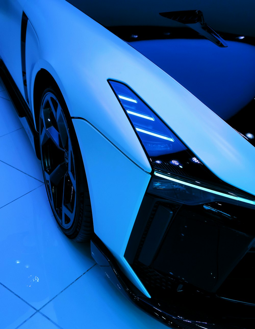 blue car with black wheel