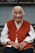 woman in red vest and white dress shirt