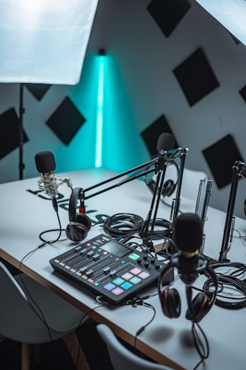 black audio mixer near black microphone