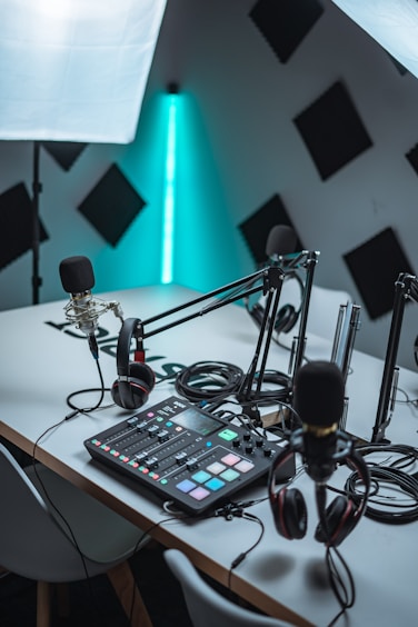 black audio mixer near black microphone