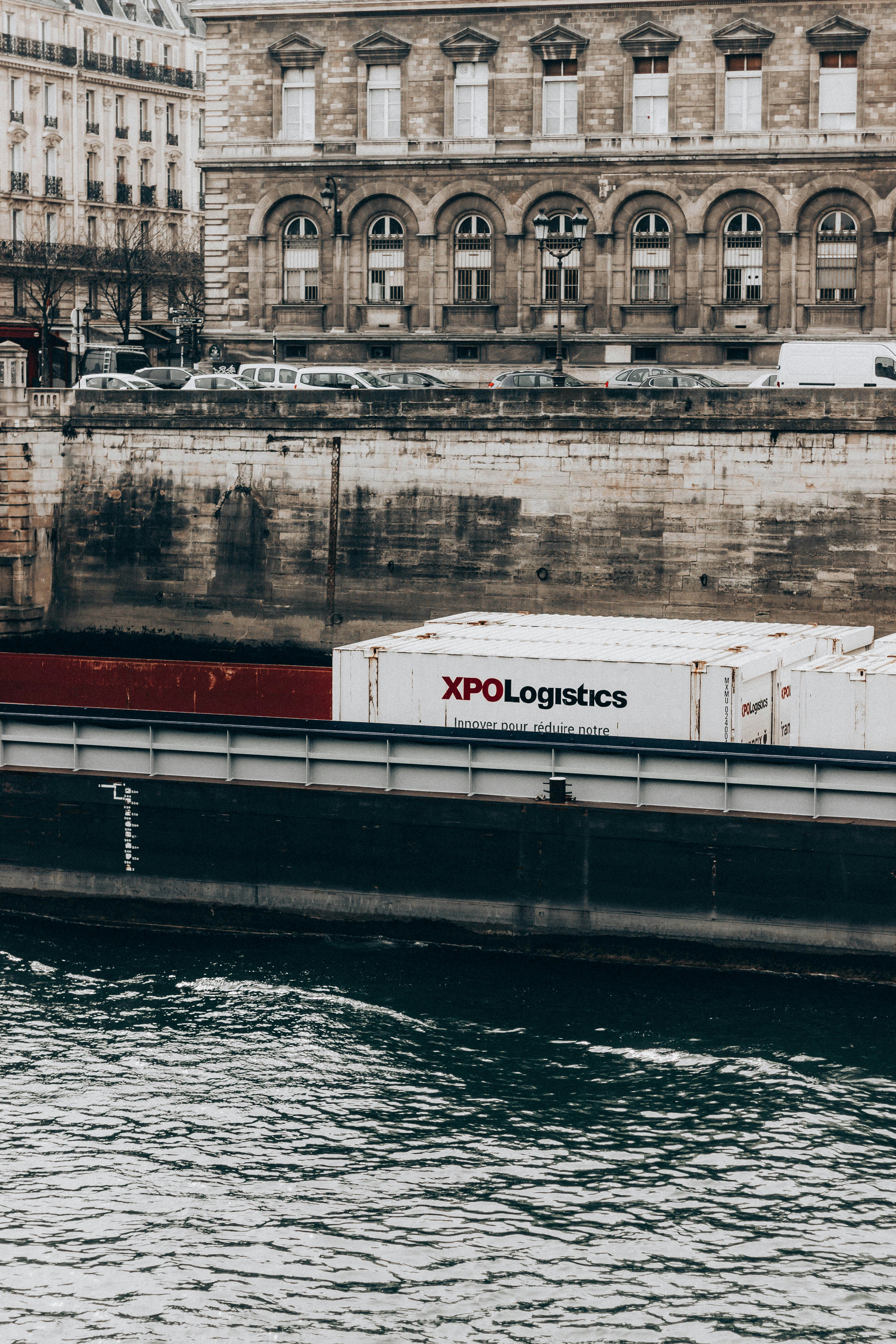 white and red ship on water during daytime