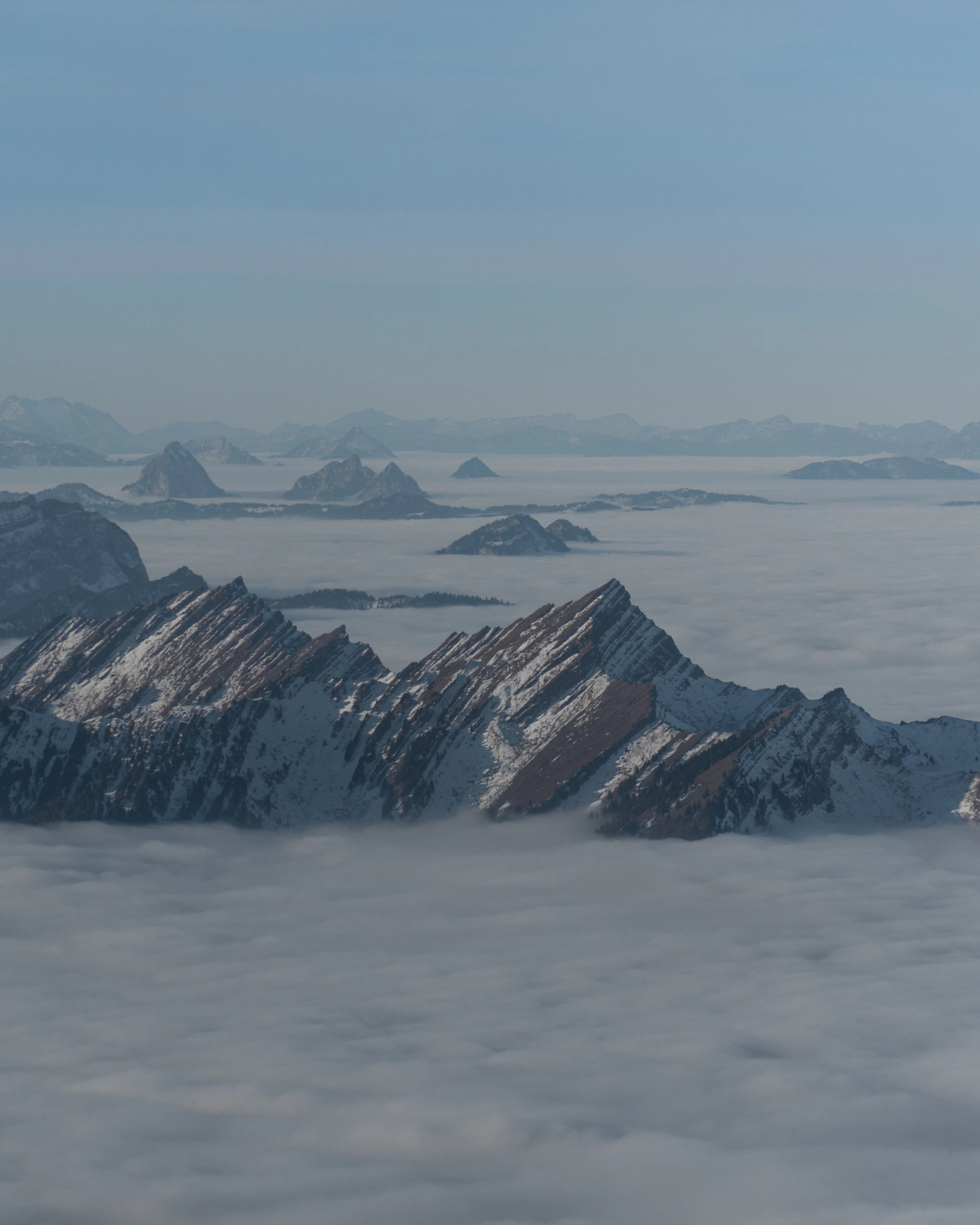 Misty snow-capped Swiss Alps at dawn, photo by Ramon Fuchs on Unsplash