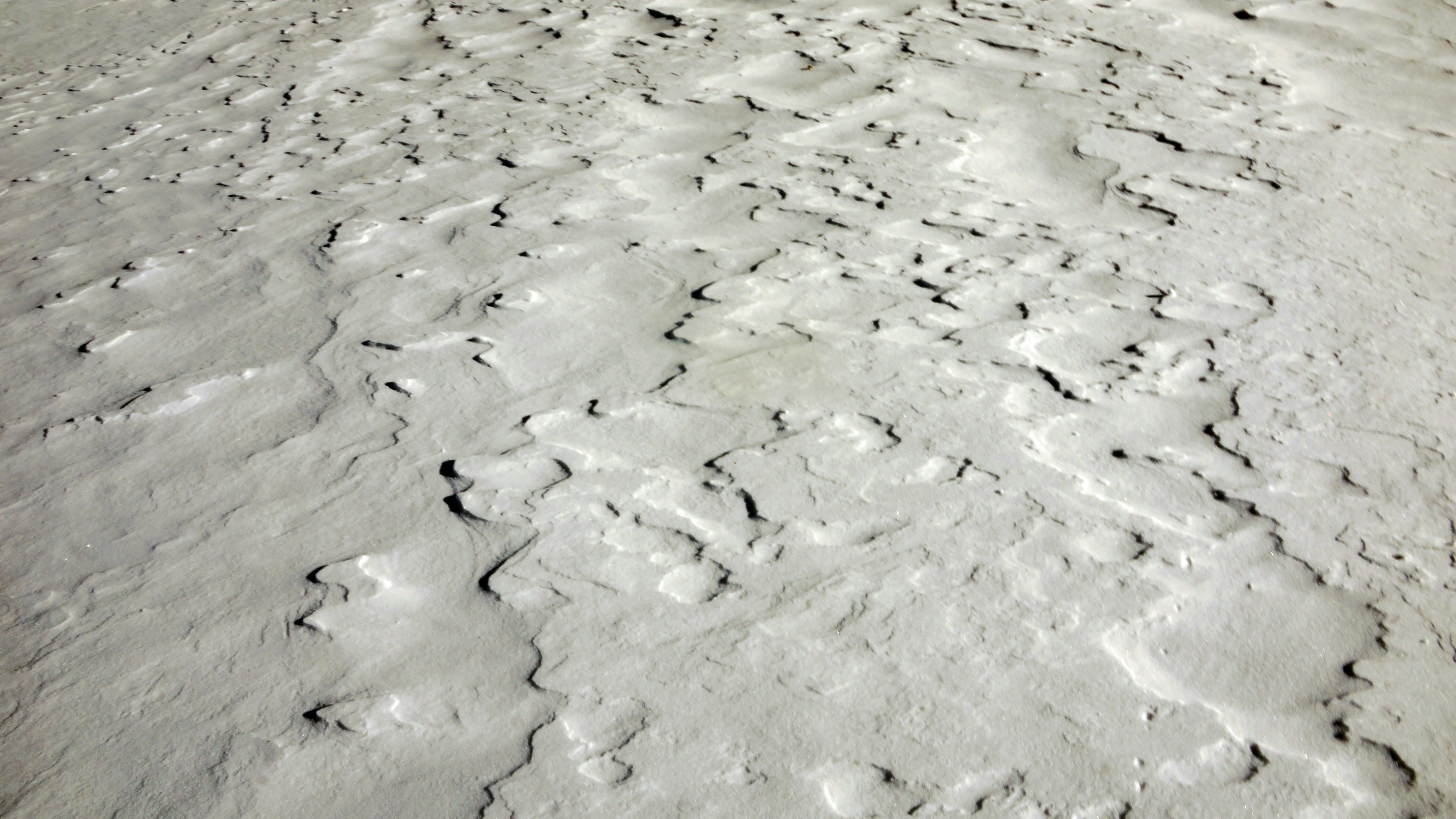 white and gray sand during daytime