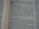 A close-up view of an open book, displaying text in a serif font. The focus is on several paragraphs with headings and lines of content, featuring dialogue and narrative elements.