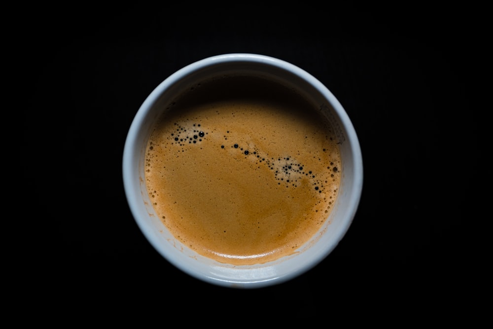 brown liquid in white ceramic mug