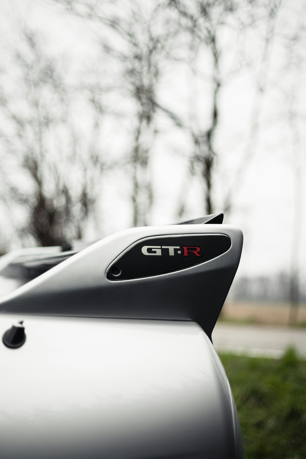 white porsche 911 parked on road during daytime