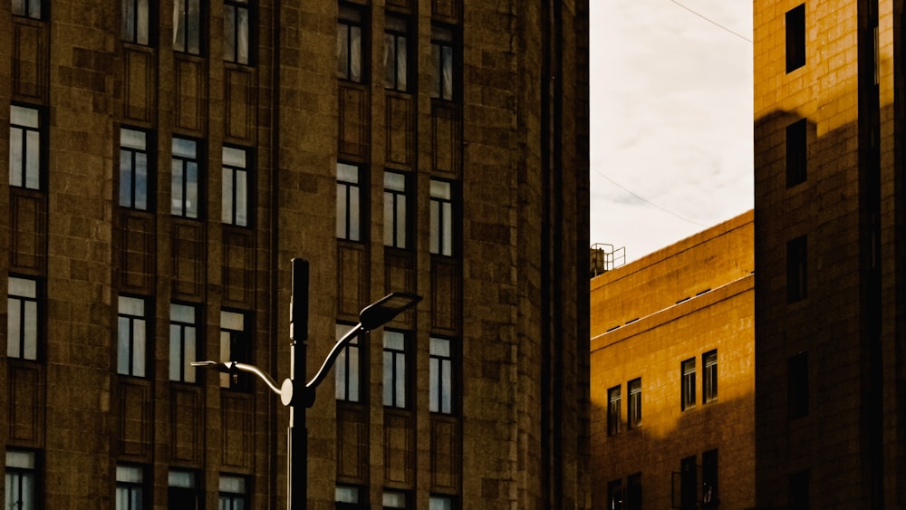 brown concrete building under white clouds during daytime