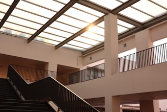 black metal staircase on white concrete building