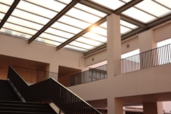 black metal staircase on white concrete building