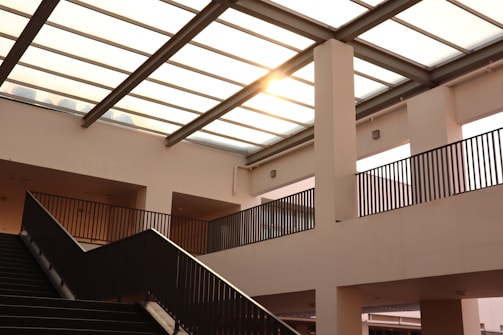 black metal staircase on white concrete building