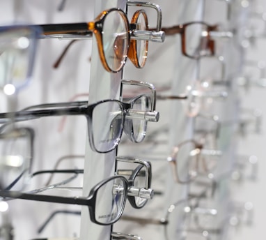 silver framed eyeglasses on clear glass