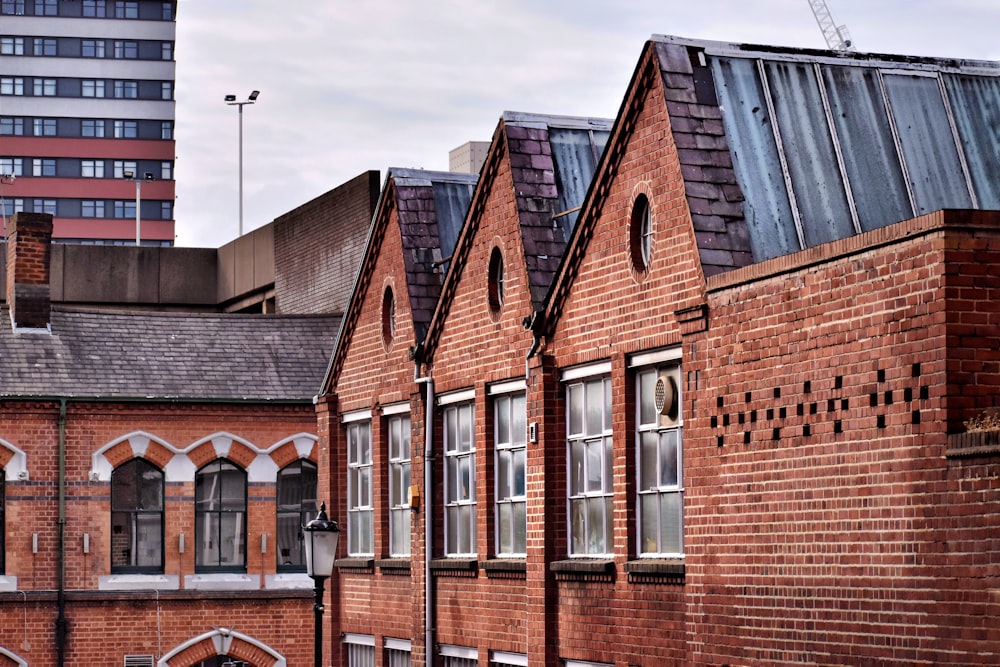 brown brick building under cloudy sky during daytime