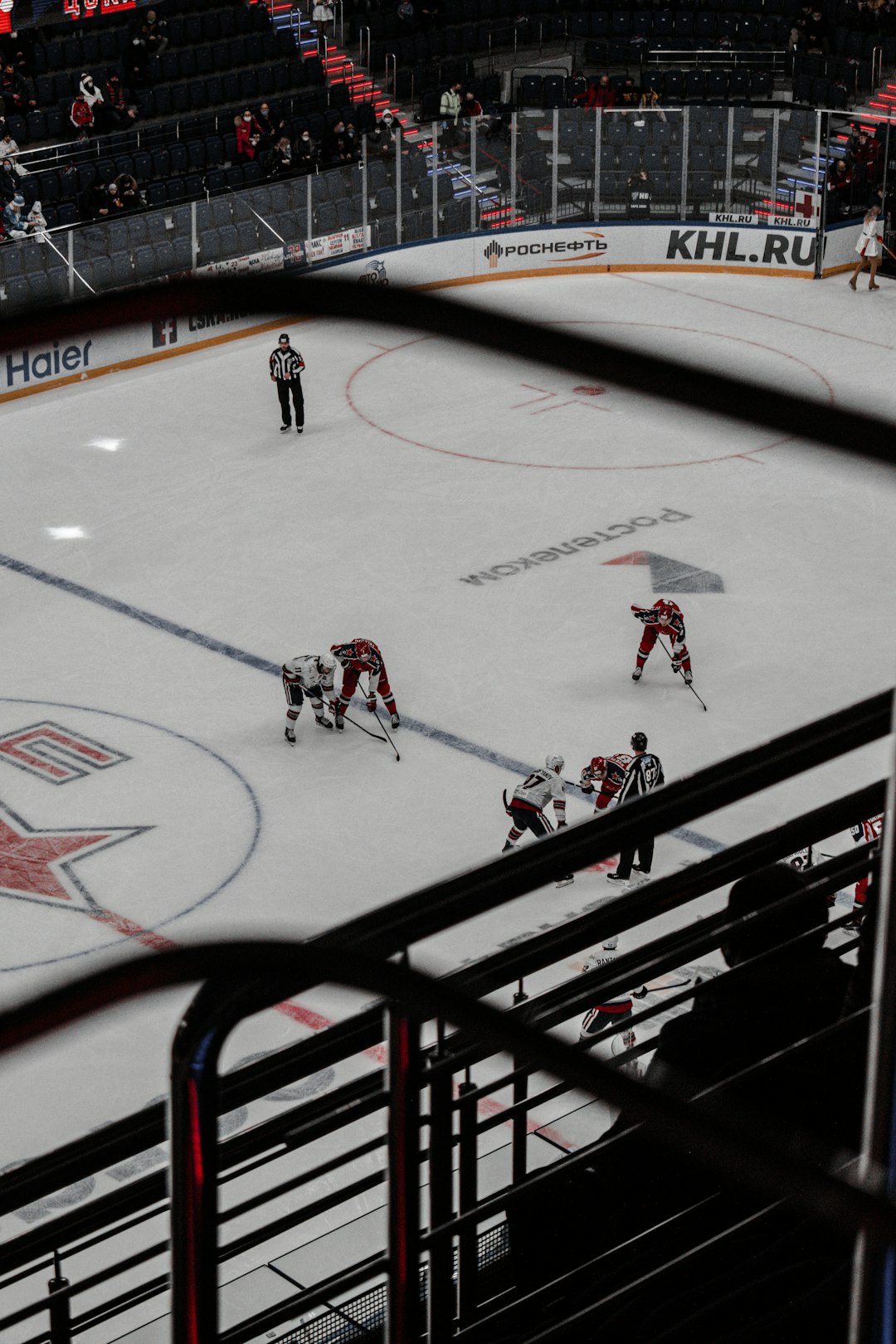 people playing ice hockey on ice field