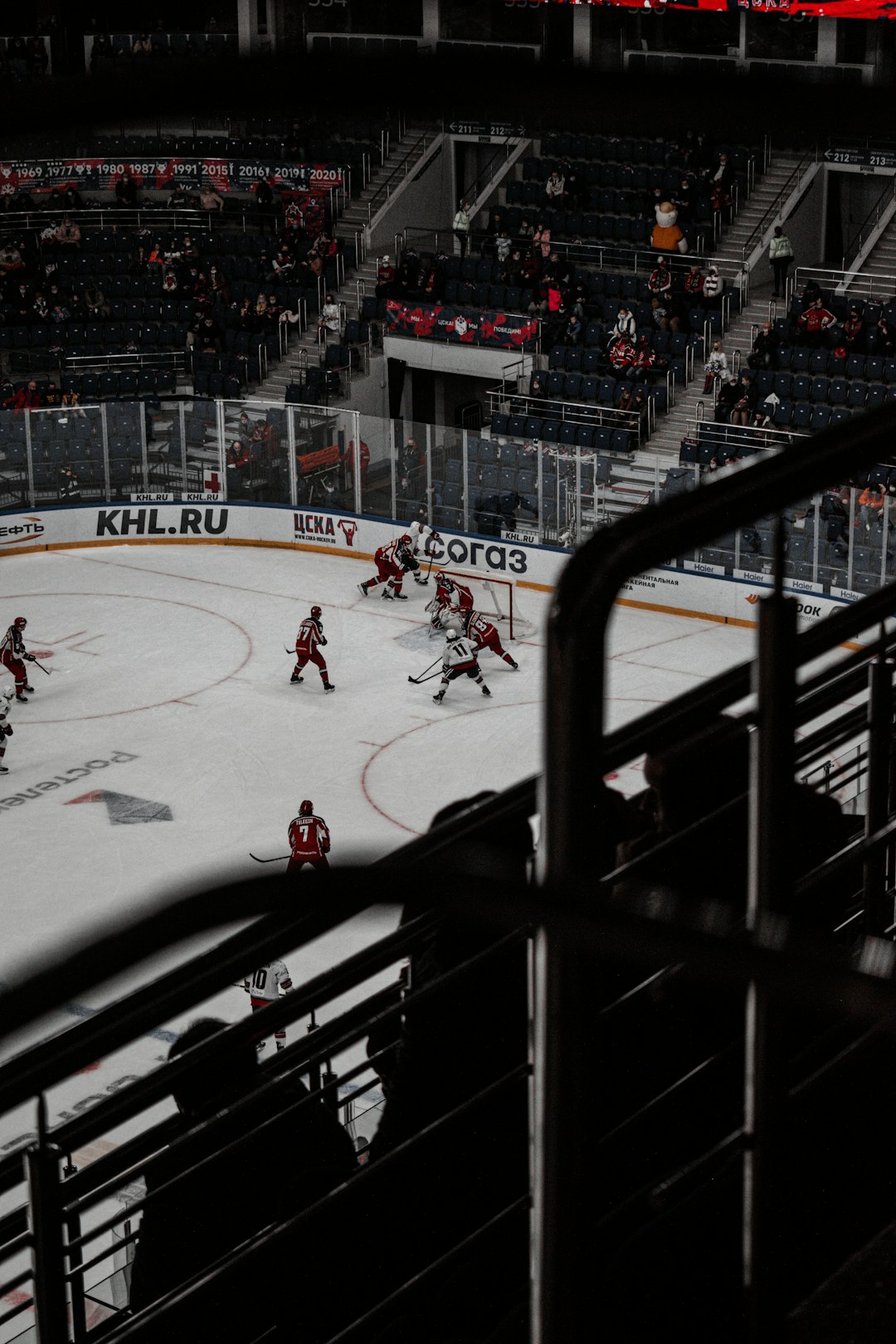 people playing ice hockey on ice stadium