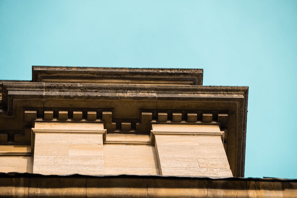 brown concrete building under blue sky during daytime