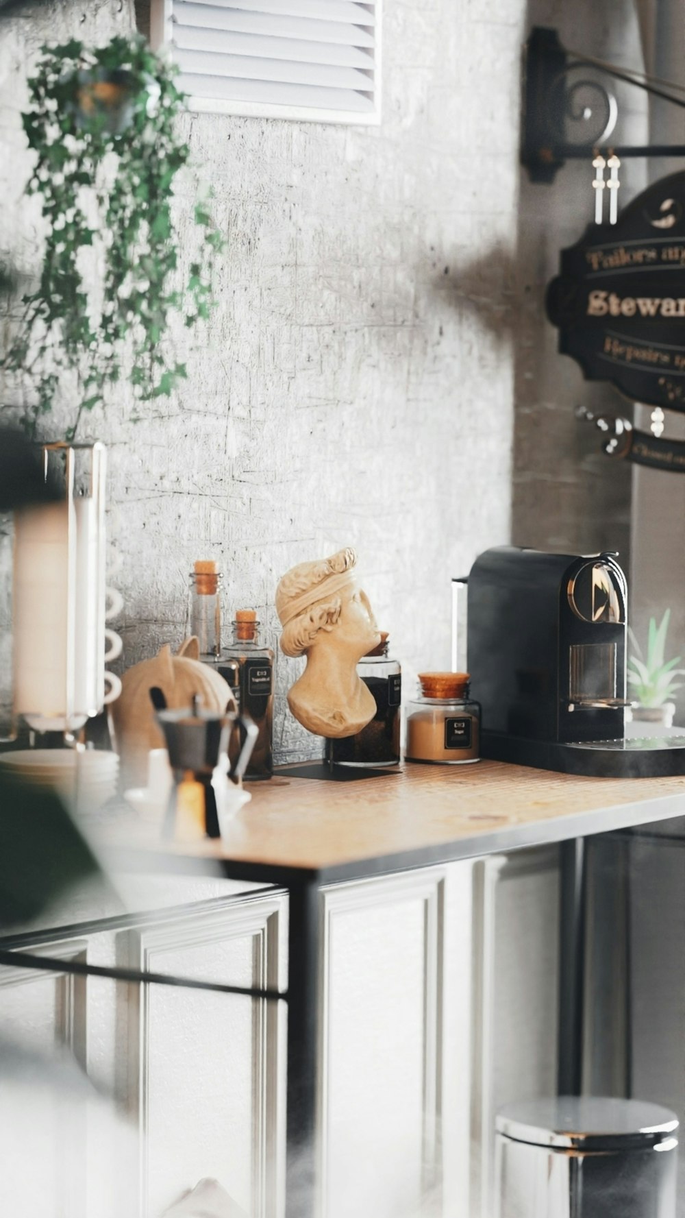 black coffee maker on brown wooden table