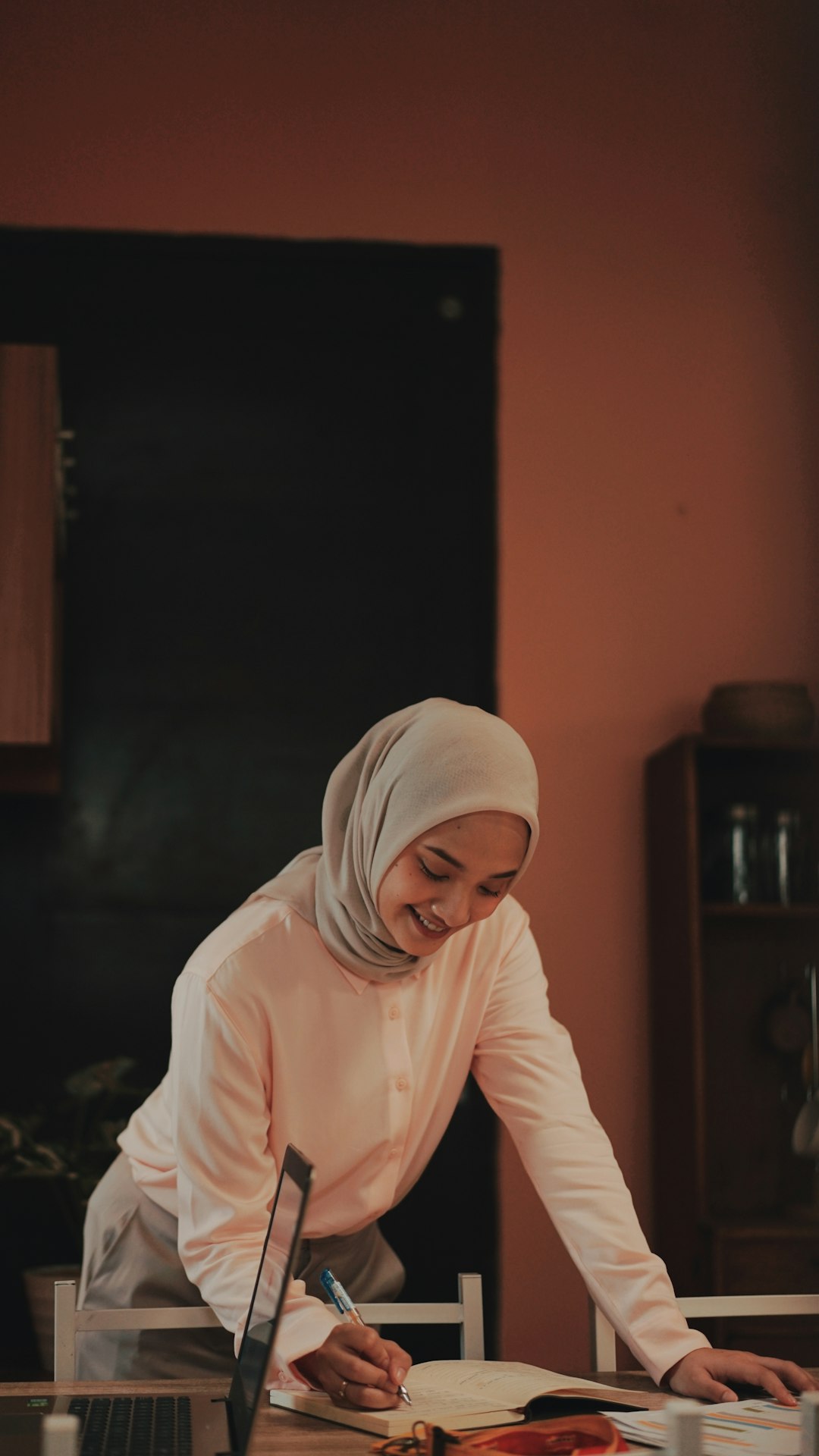 woman in white hijab sitting on chair