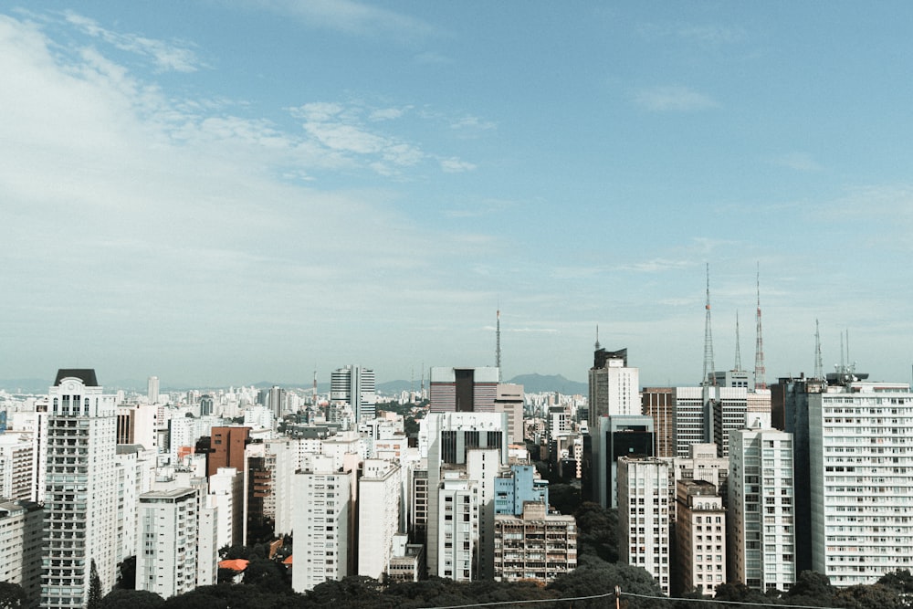 city skyline under blue sky during daytime