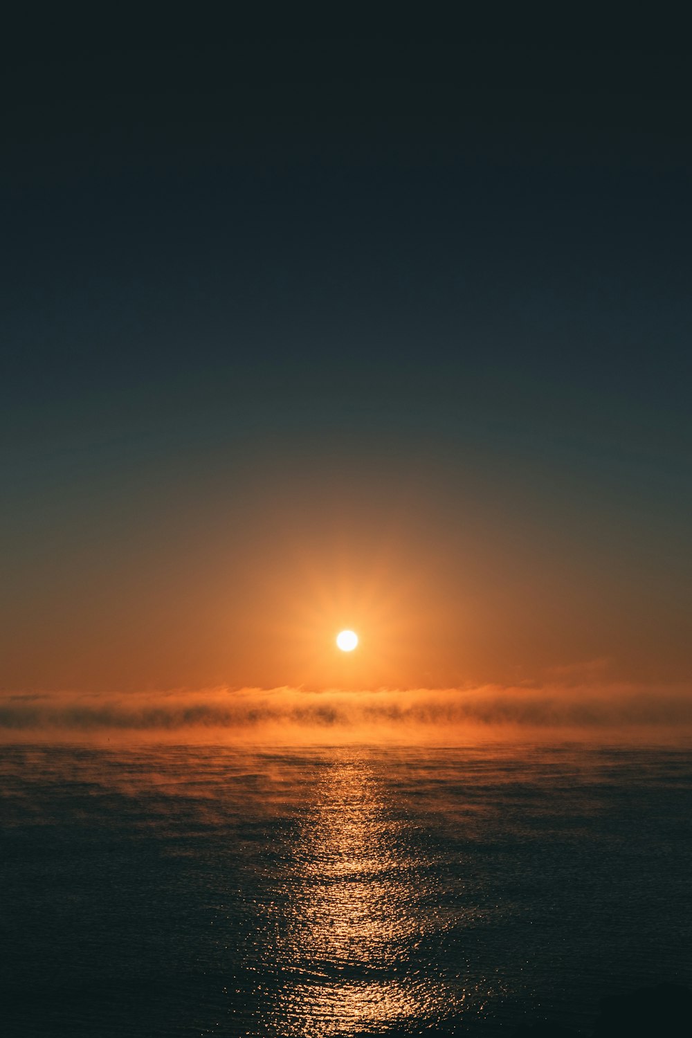 body of water during sunset