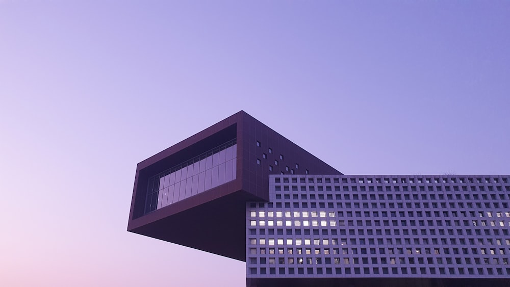 black and white concrete building under blue sky during daytime