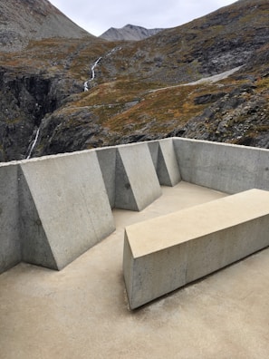 Modern patio design featuring smooth concrete slabs and minimalist landscaping.