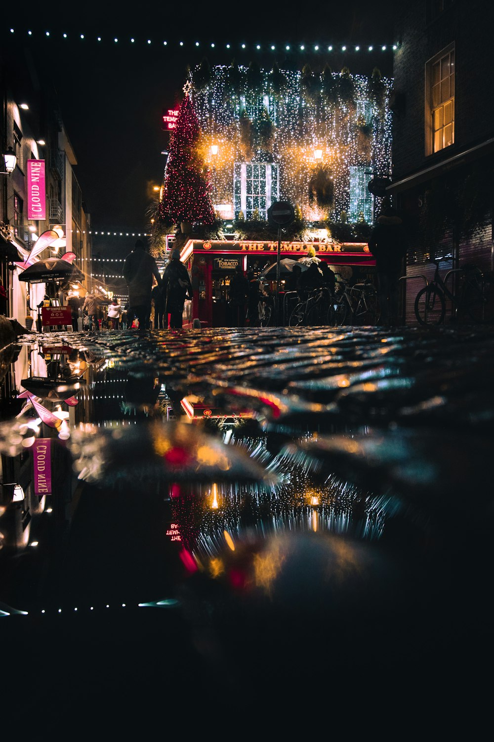 people walking on street during night time