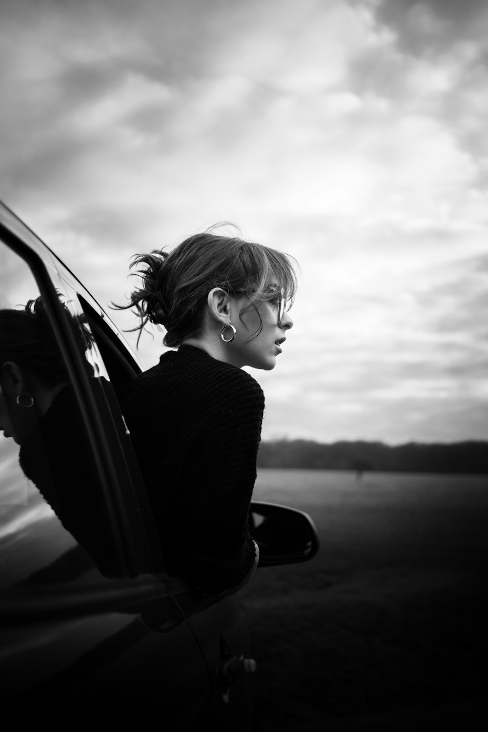 grayscale photo of woman in black long sleeve shirt