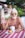 topless man wearing sunglasses sitting on chair