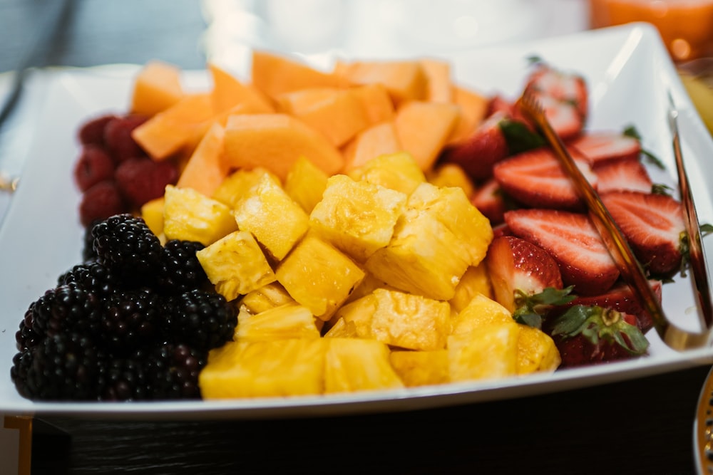 sliced fruits on black ceramic plate