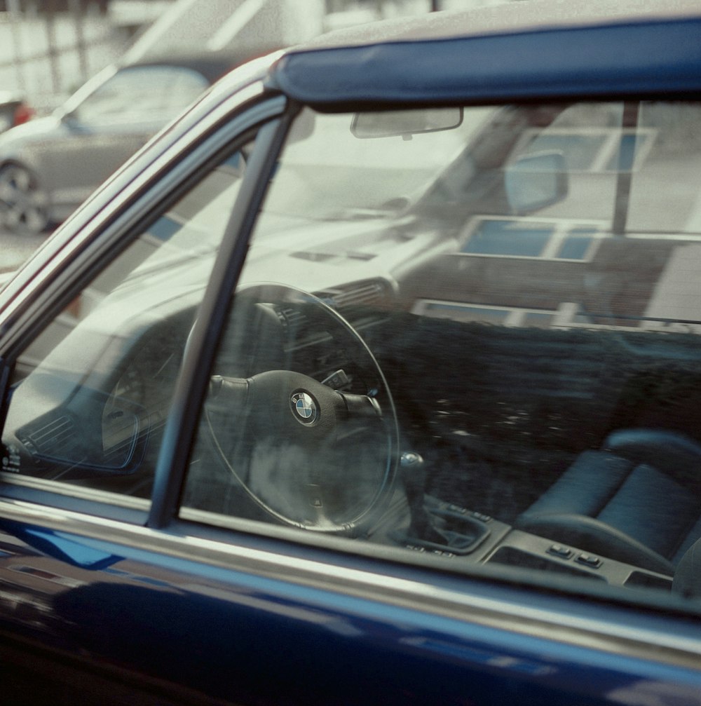 blue car with black steering wheel