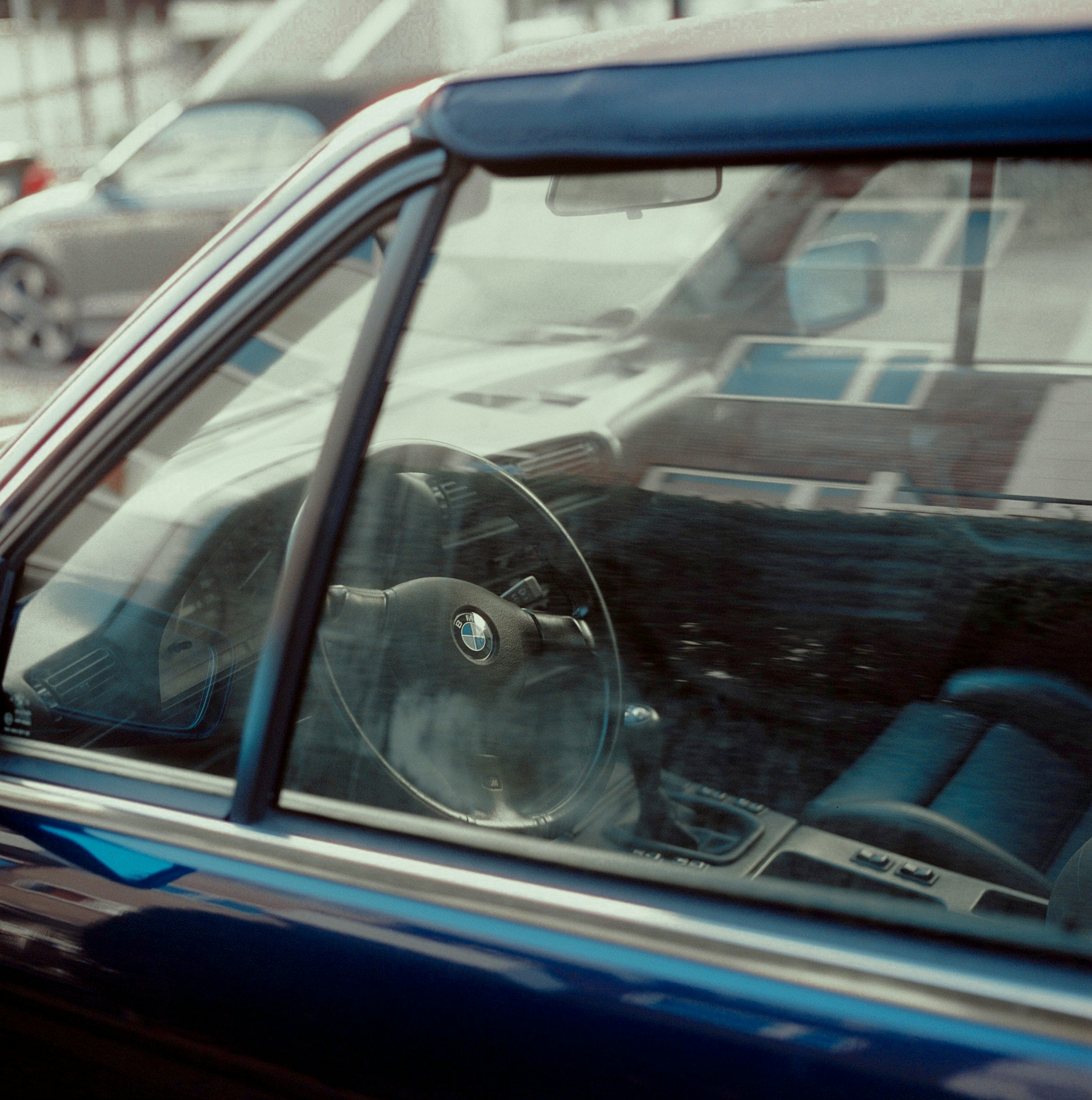 blue car with black steering wheel