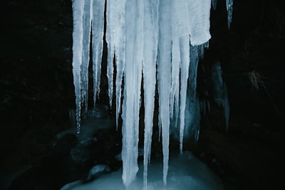 white and black cave with water icicle google meet background