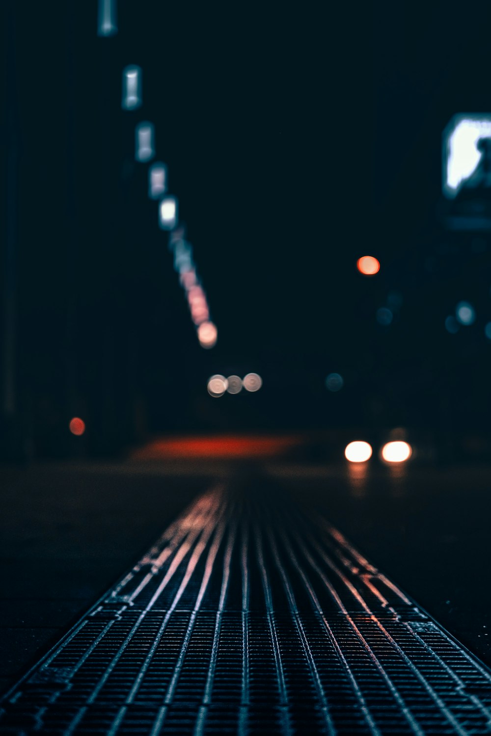 a city street at night with street lights