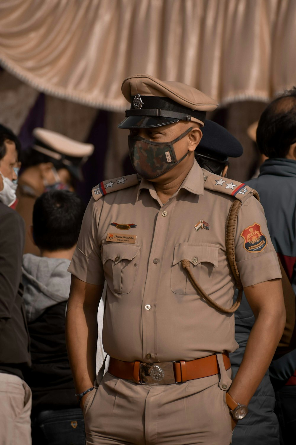 man in brown and green camouflage uniform