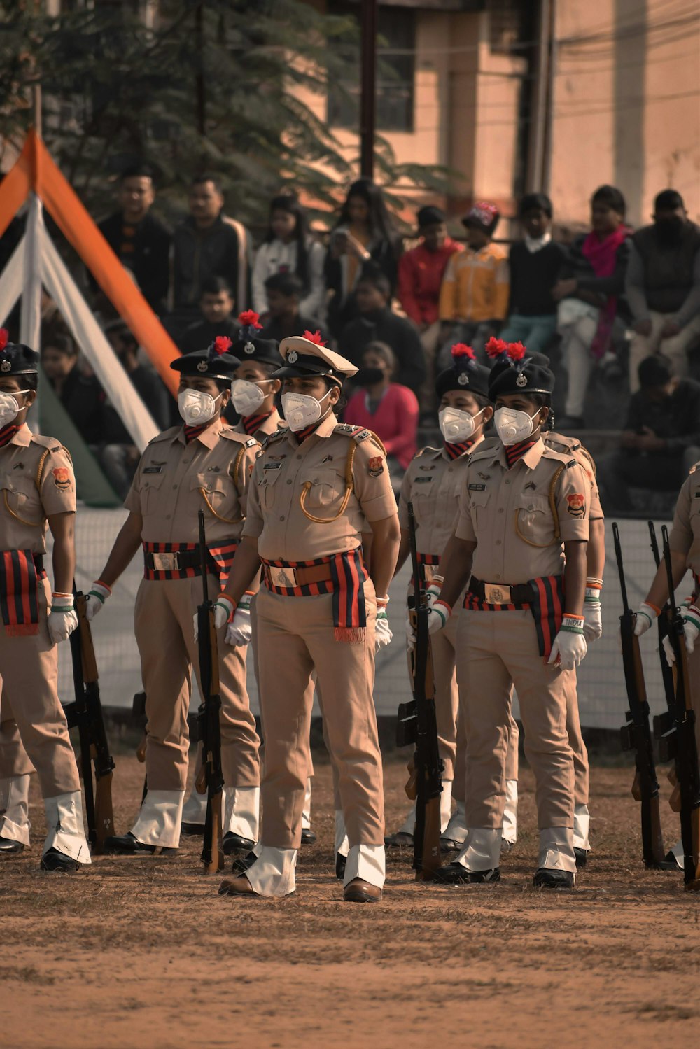 men in brown uniform standing during daytime