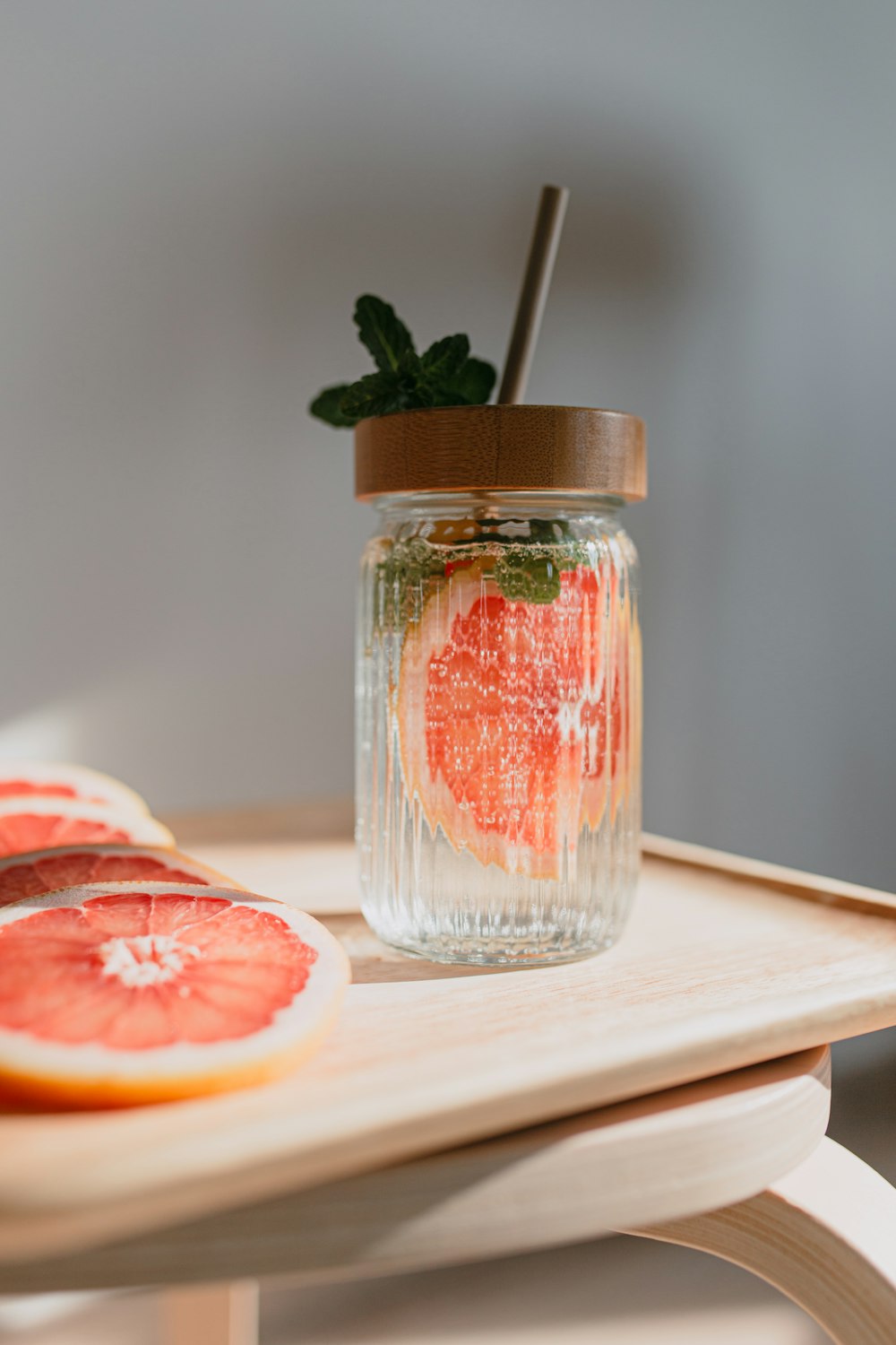 sliced orange fruit in clear glass jar