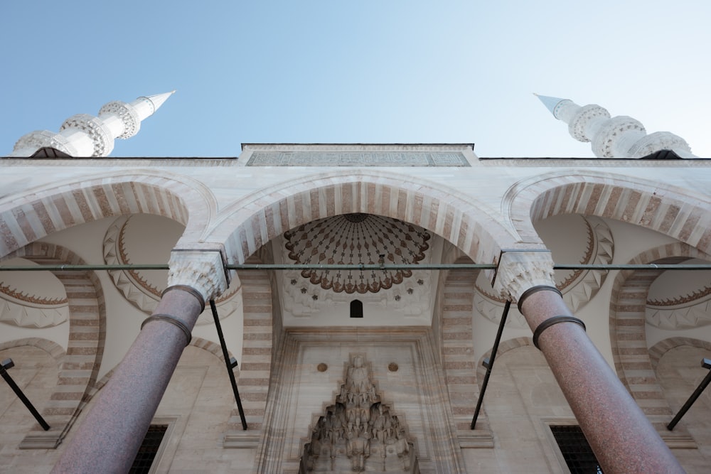 white bird flying over the building