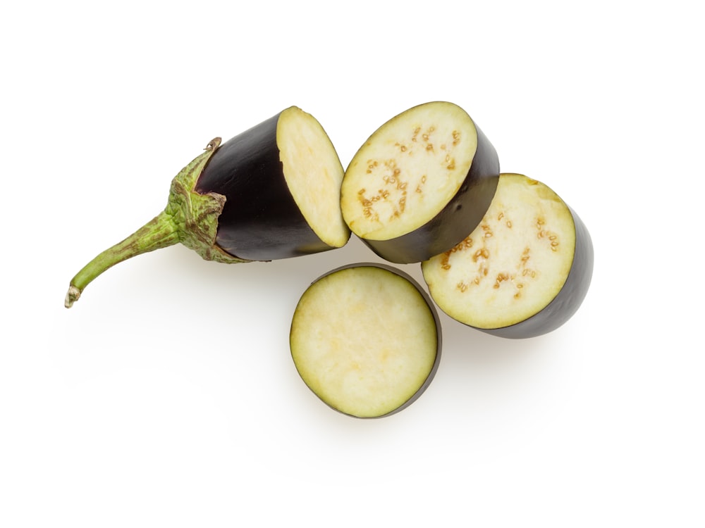 sliced green fruit on white surface