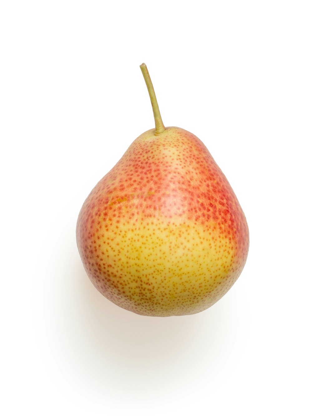 yellow and red round fruit