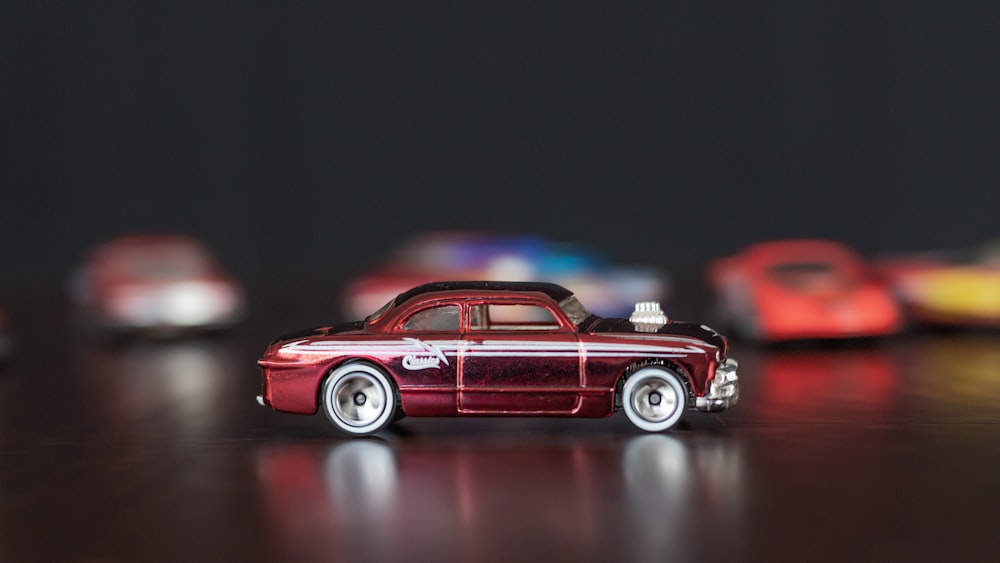 red and white vintage car scale model