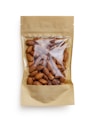 A brown paper bag with a transparent window displaying a collection of whole almonds. The packaging is simple and minimalistic, focusing on the natural appearance of the almonds inside.
