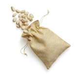 Fresh sunflower and pumpkin seeds spilling from a burlap sack.