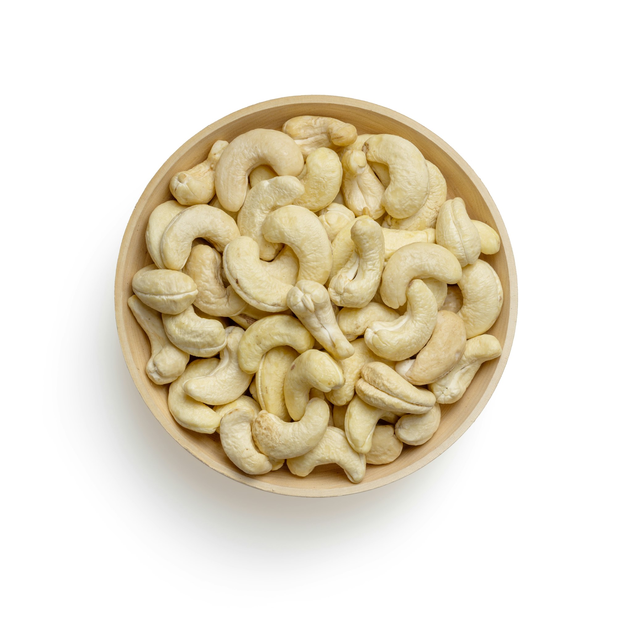 brown wooden round bowl of cashews with white background
