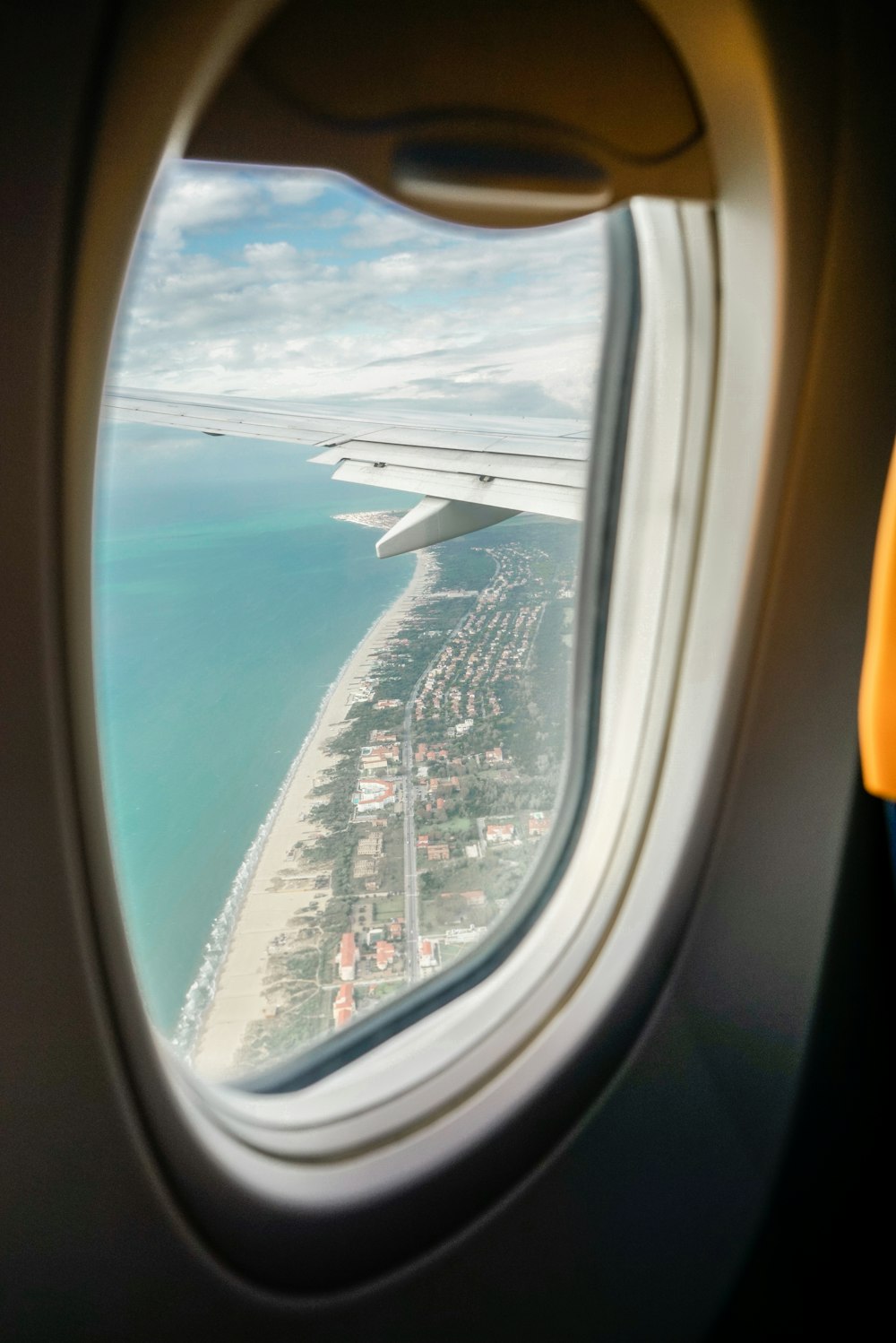 airplane window view of city during daytime