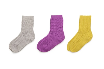 blue and black socks on white background