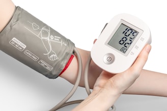 white and black digital blood pressure device 