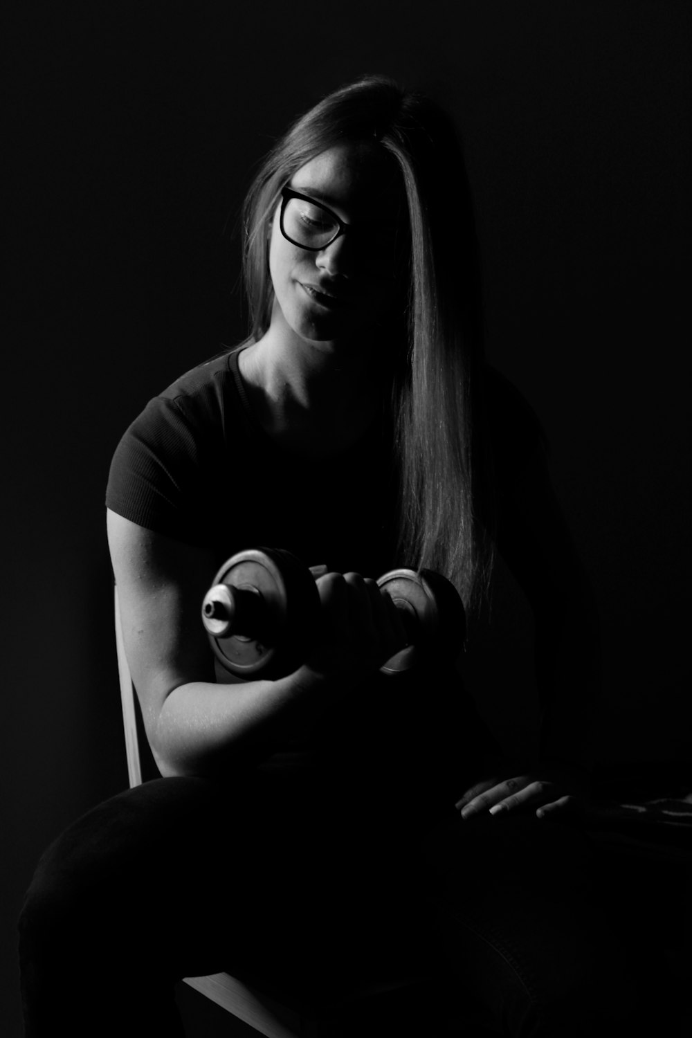 woman in black t-shirt sitting on floor